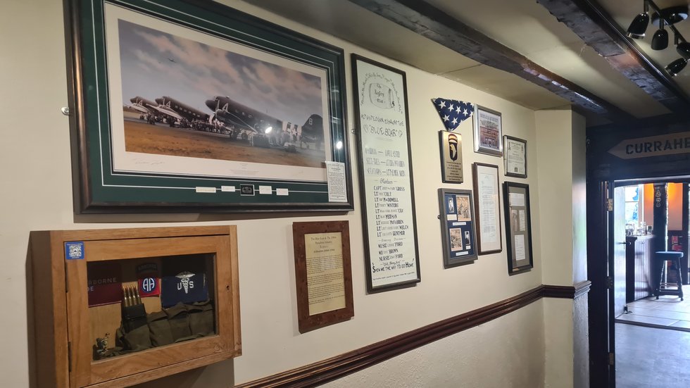 A wall dedicated to the men of Easy Company in the Blue Boar Pub Aldbourne