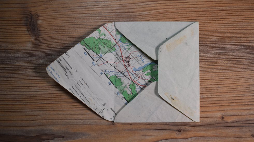 Photograph of the back of the same 1948 envelope showing the map printing clearly visible on the paper