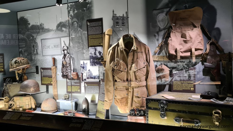 Display outside the Dead Man’s Corner Museum in Saint-Côme-du-Mont, featuring a German officer mannequin and wartime equipment