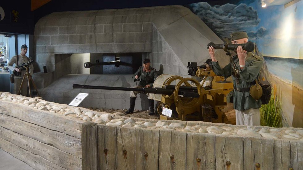 Full-scale German casemate with anti-tank and anti-aircraft guns at the Omaha Beach Memorial Museum