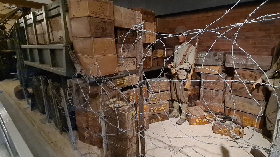 U.S. military truck loaded with World War II-era ammunition and ration crates at the World War II Museum in Quinéville