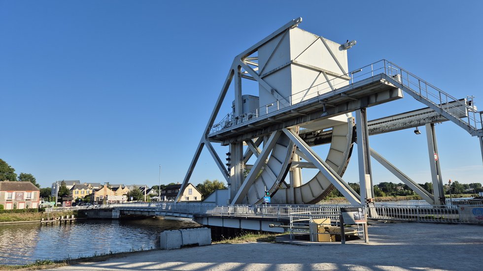 The modern Pegasus Bridge with the German anti-tank gun and Café Gondrée visible in the background