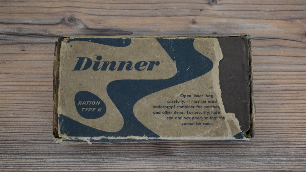 Outer carton of the “Moral” Dinner K-ration showing camouflage print and ration details