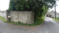 Wide view of the memorial plaque honoring the 1st U.S. Infantry Division at Russy Mairie, Normandy