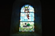 A stained glass window in Angoville Au Plain Church from 6 June 1944