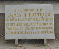 Gourbesville church yard, plaque in memory of James R Hattrick close up