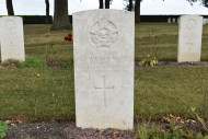 The grave of F/O J.F. DEWAR, Bretteville-sur-Laze Canadian War Cemetery