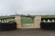 Entrance gateway into Secqueville-en-Bessin War Cemetery